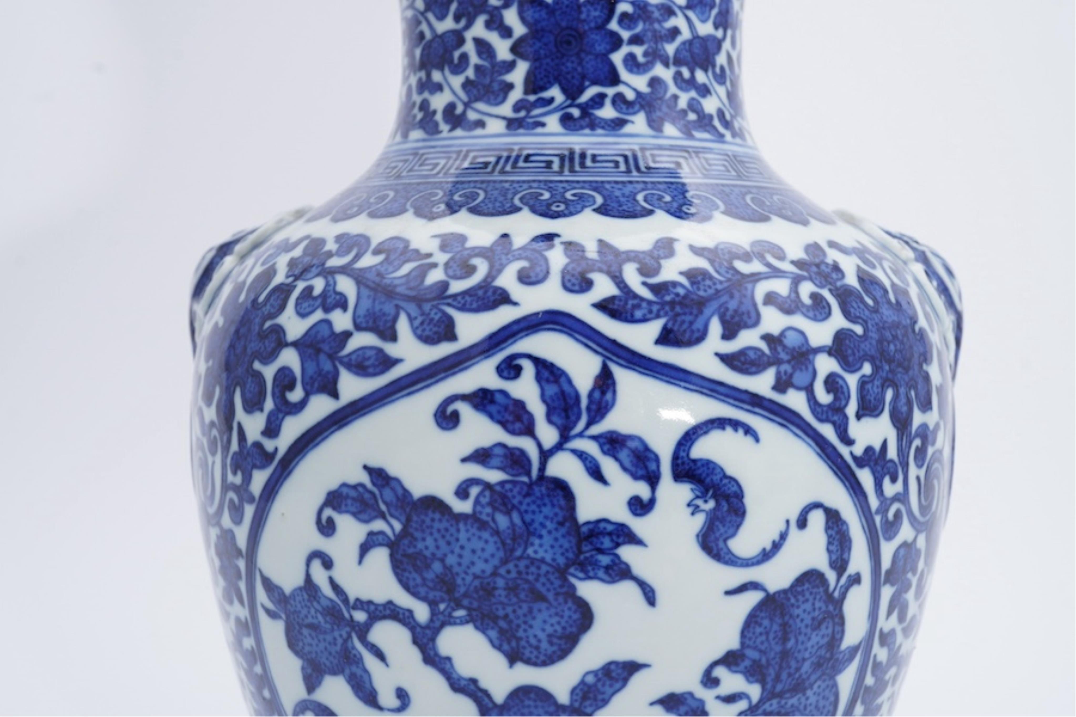 A Chinese blue and white 'peaches' vase, Qianlong mark but later, 27cm high. Condition - good